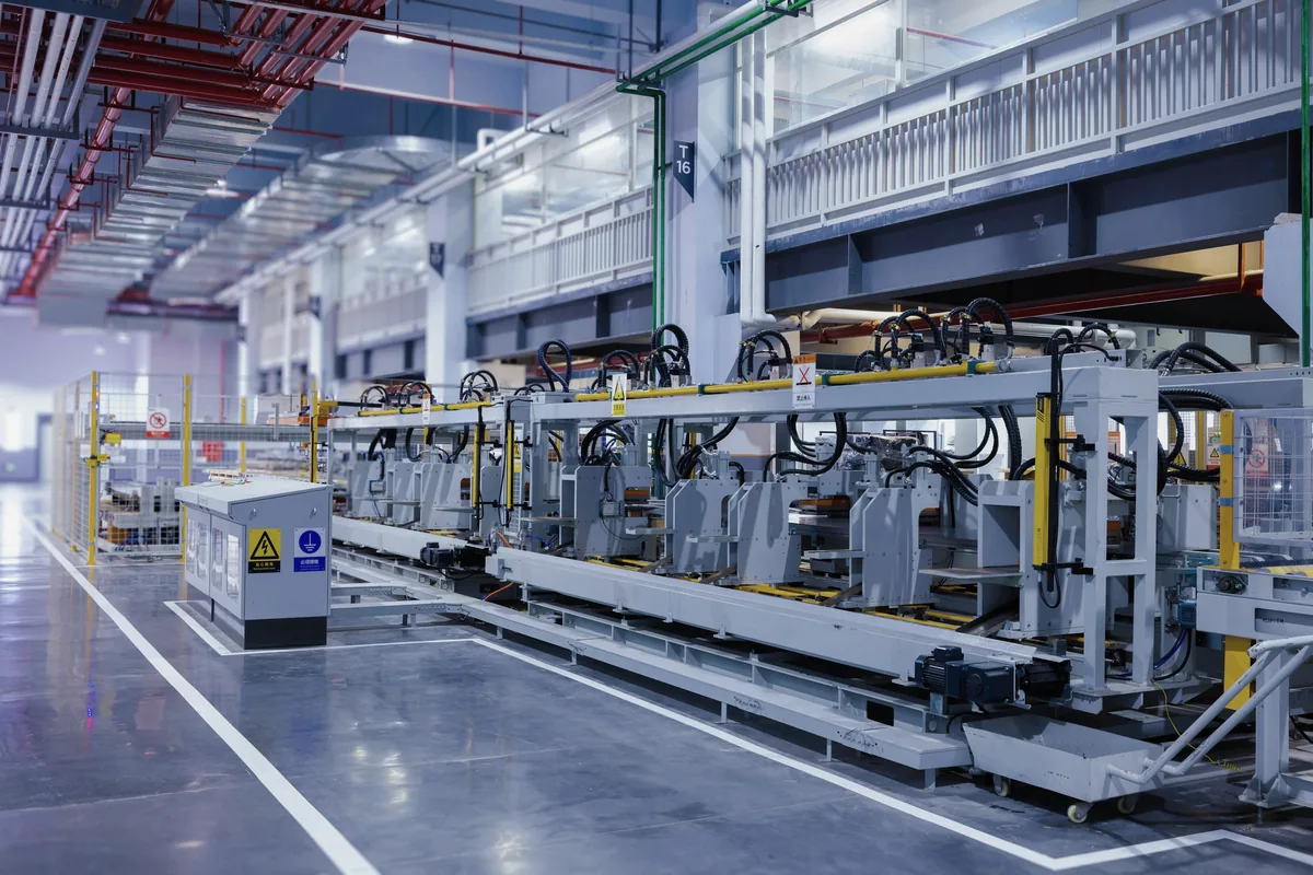 Automated production equipment on a factory floor